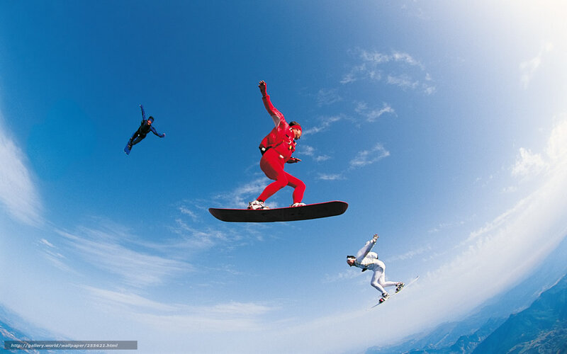 Snowboarders in mid-air
