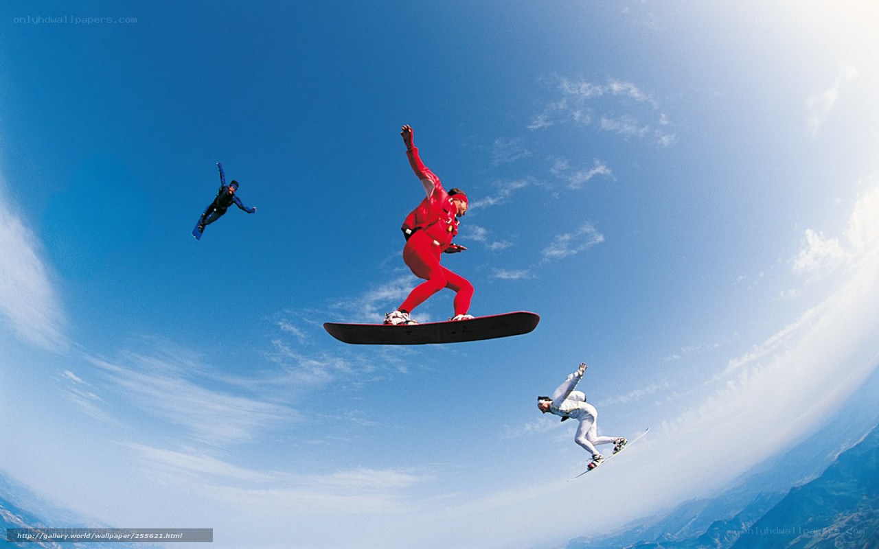 Snowboarders in mid-air