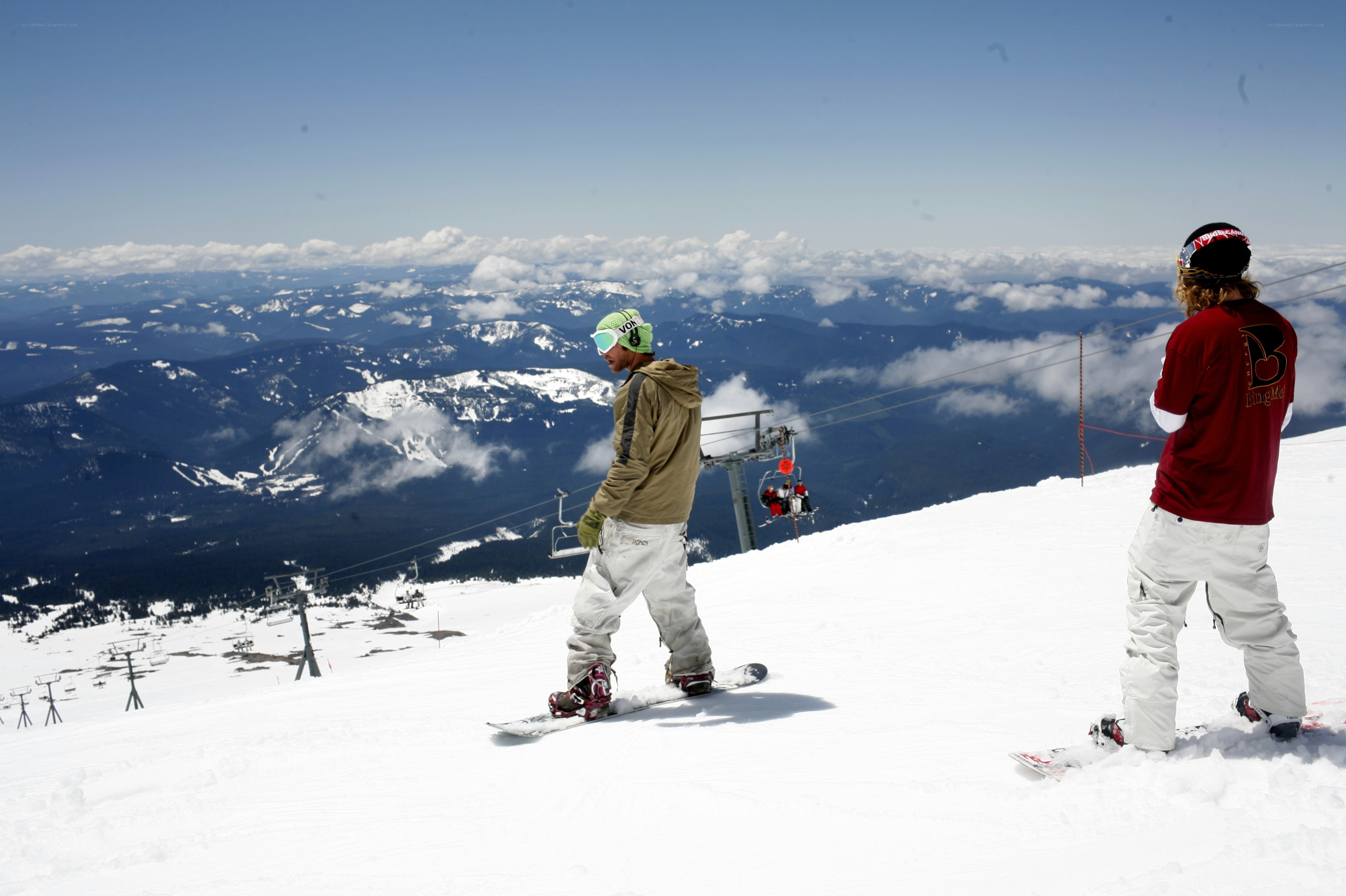 Snowboarders on a mountain slope