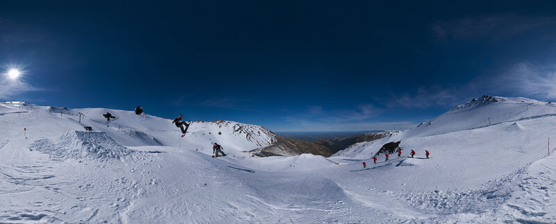 Snowboarders on a sunny mountain