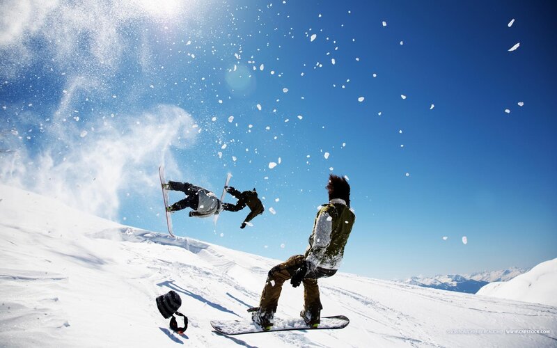 Snowboarders Performing Tricks — Blue