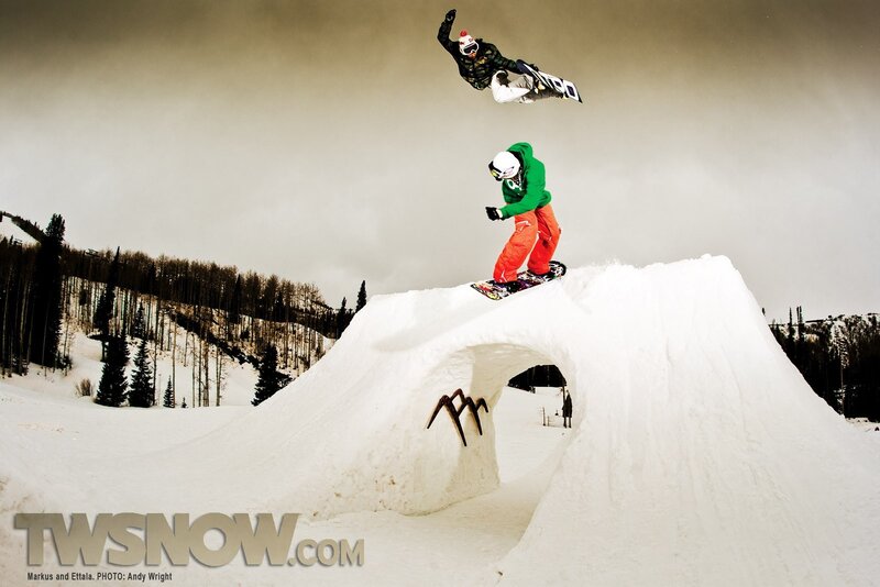 Snowboarders performing tricks