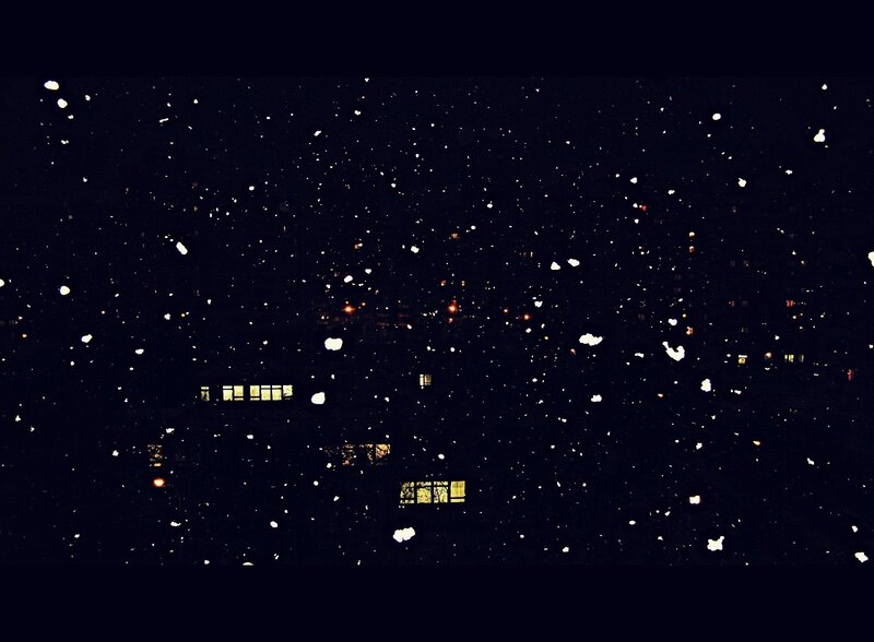 Snowfall over City Buildings