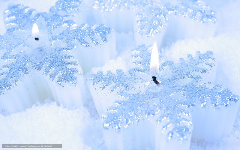 snowflake candles in snow