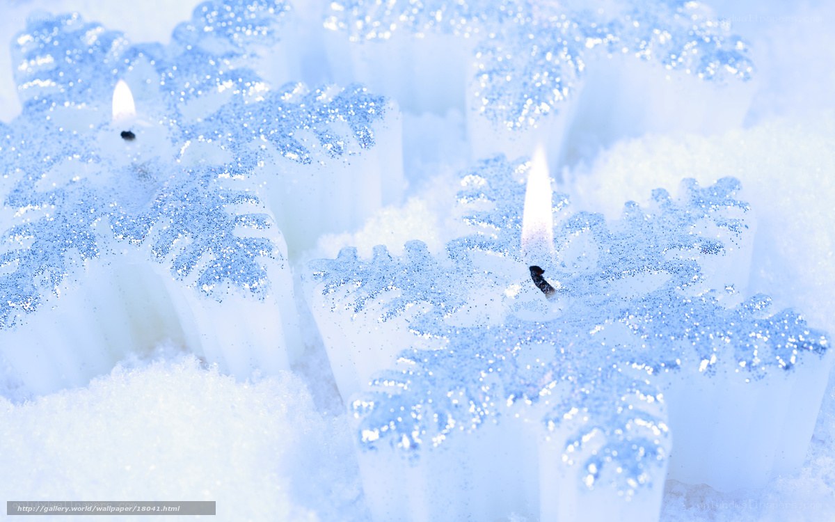 snowflake candles in snow