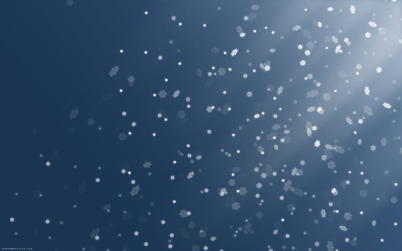 snowflakes falling in blue light