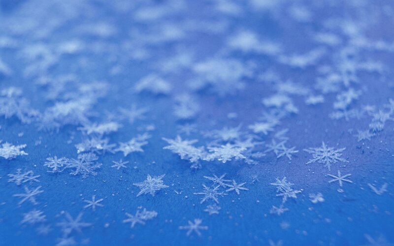 Snowflakes on Blue Surface