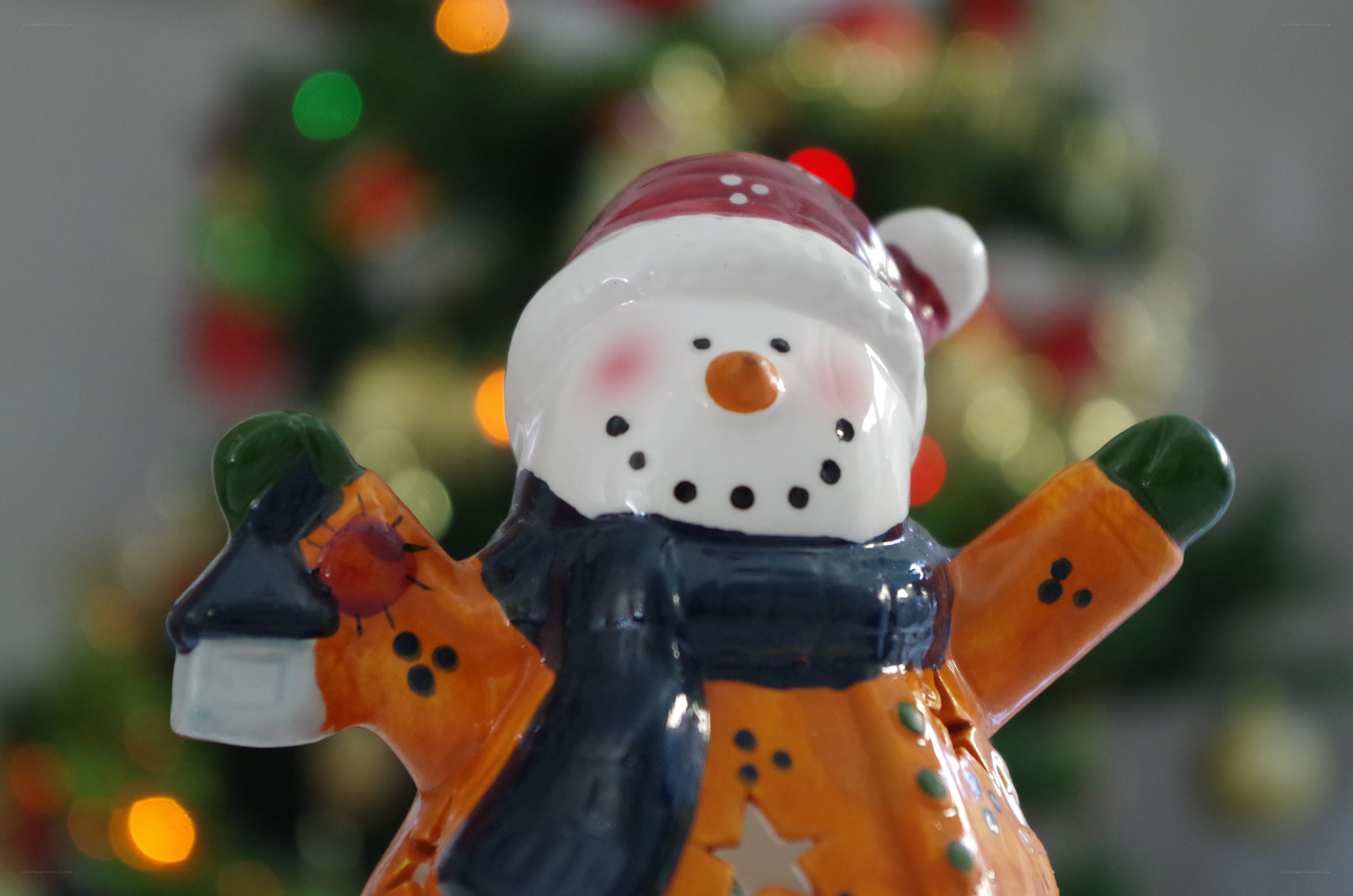 snowman figurine with Christmas tree