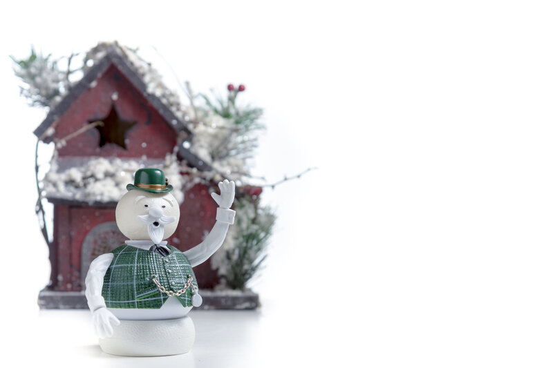 snowman figurine with red house