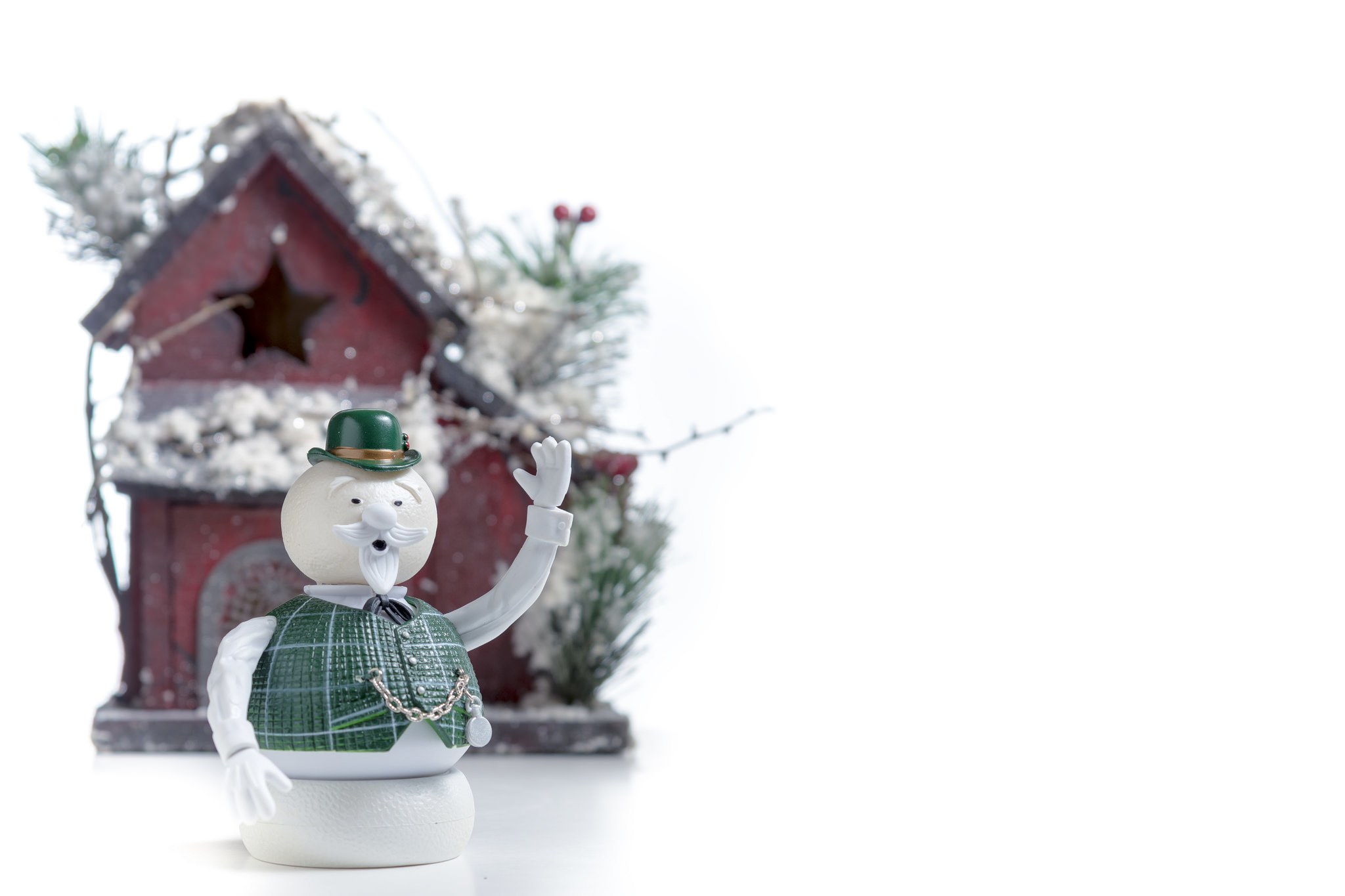 snowman figurine with red house