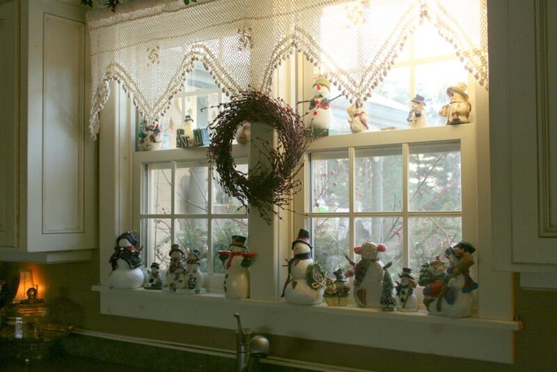 Snowman Figurines on Windowsill