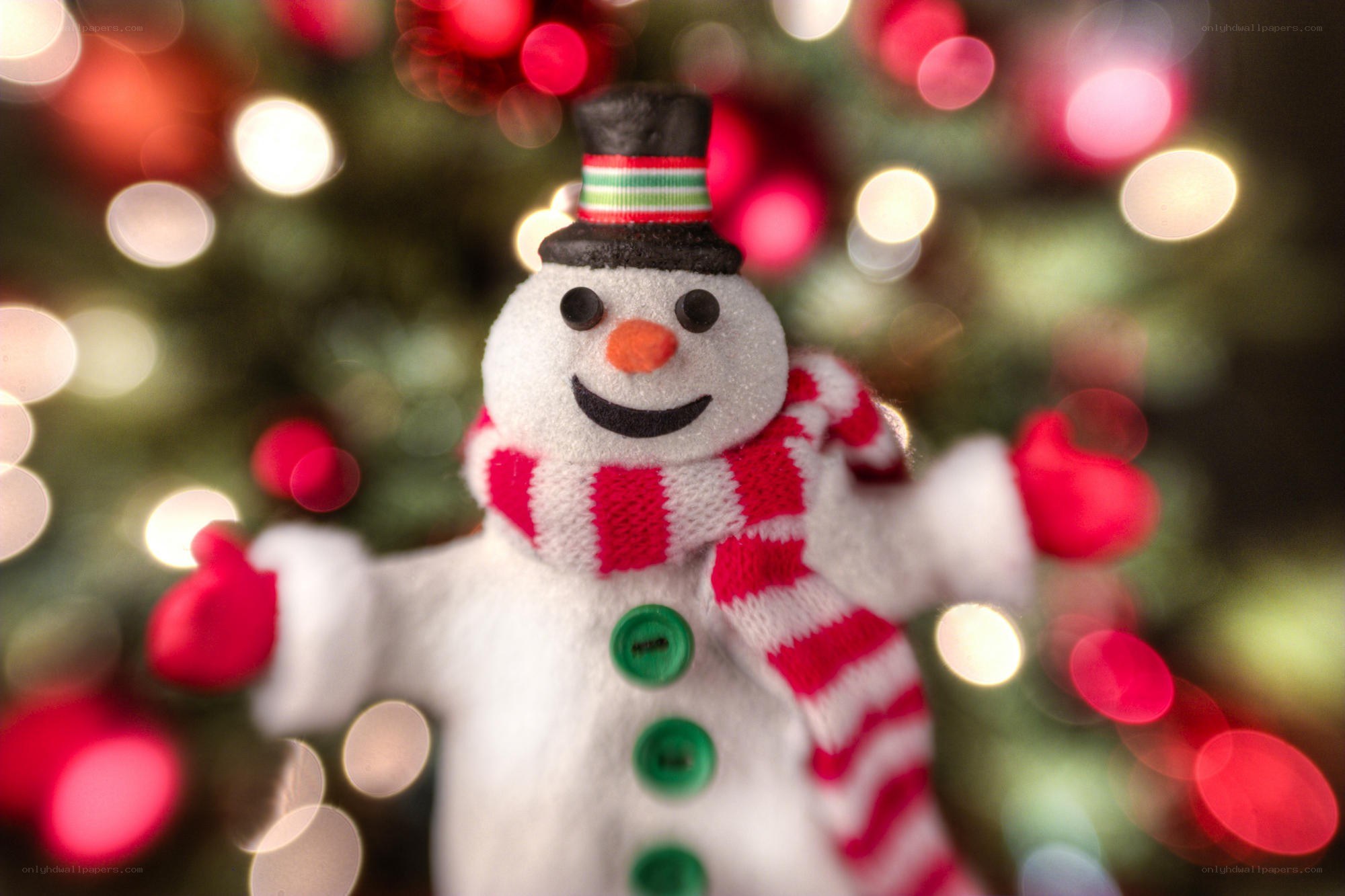Snowman ornament by Christmas tree