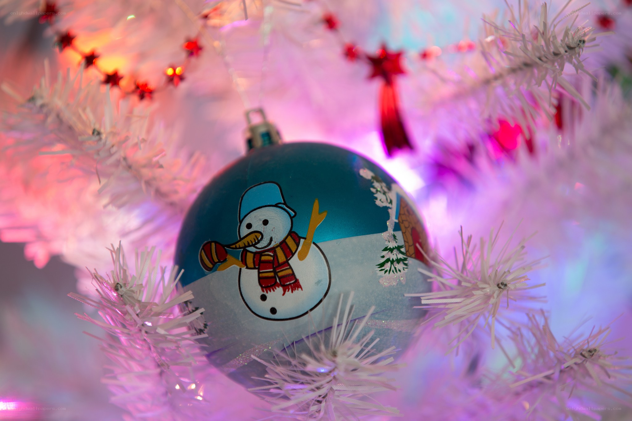 snowman ornament on white tree
