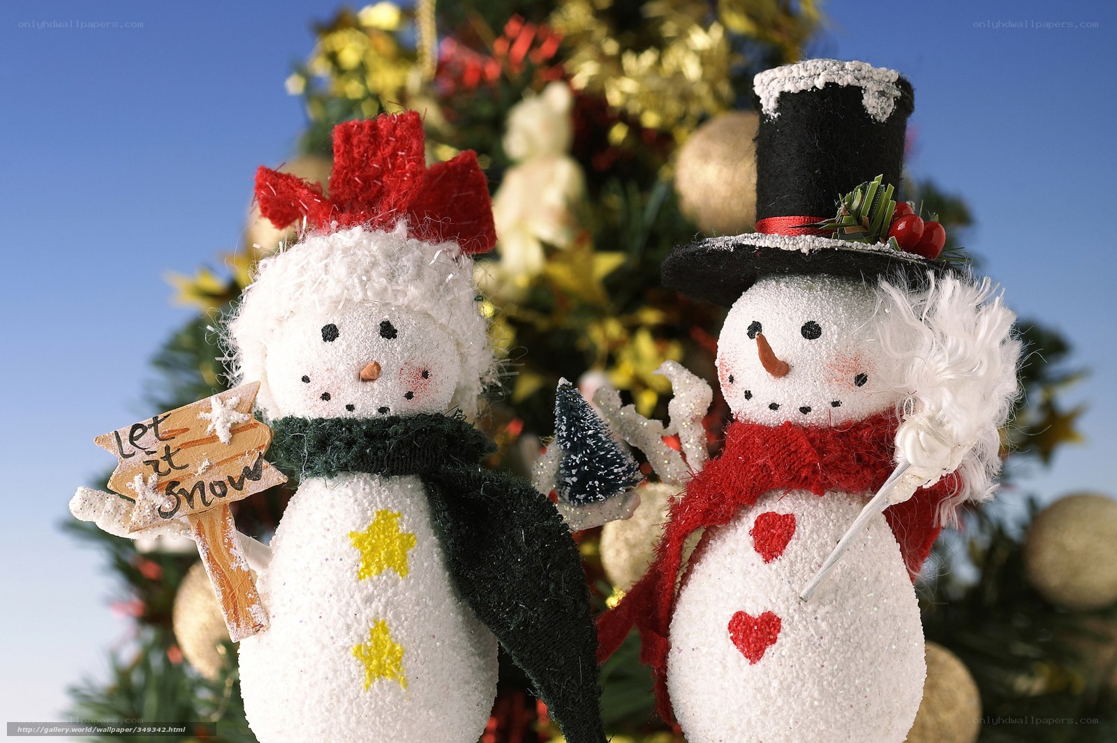 Snowman ornaments on Christmas tree