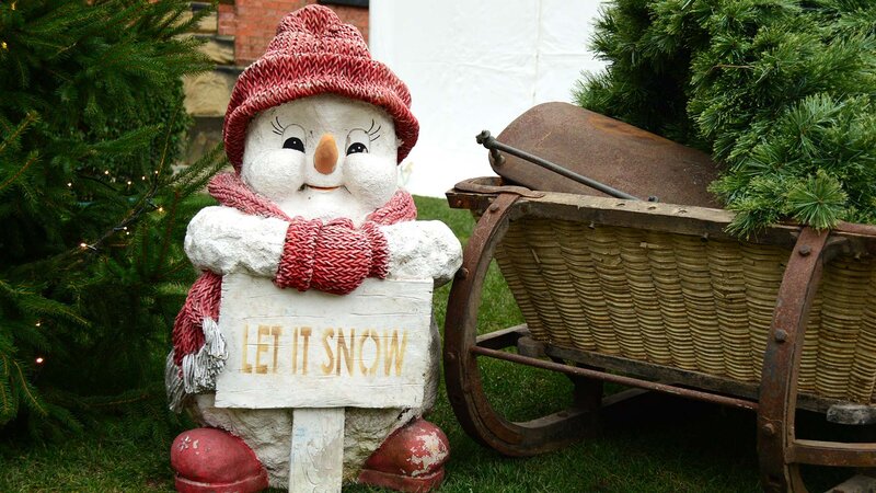 Snowman Statue Holding Sign