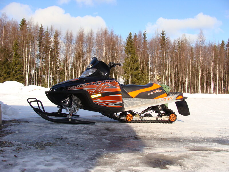 Snowmobile in Snow — Black, Cold