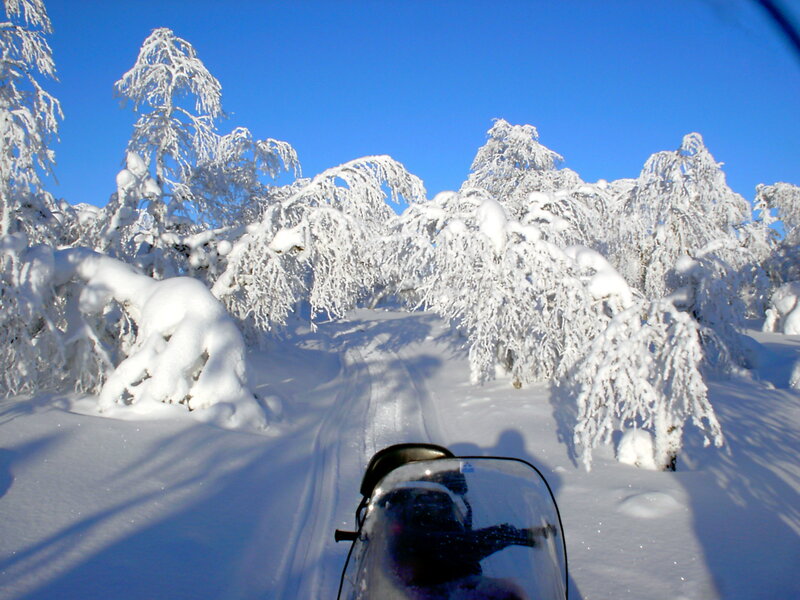 Snowmobile in Snow — White