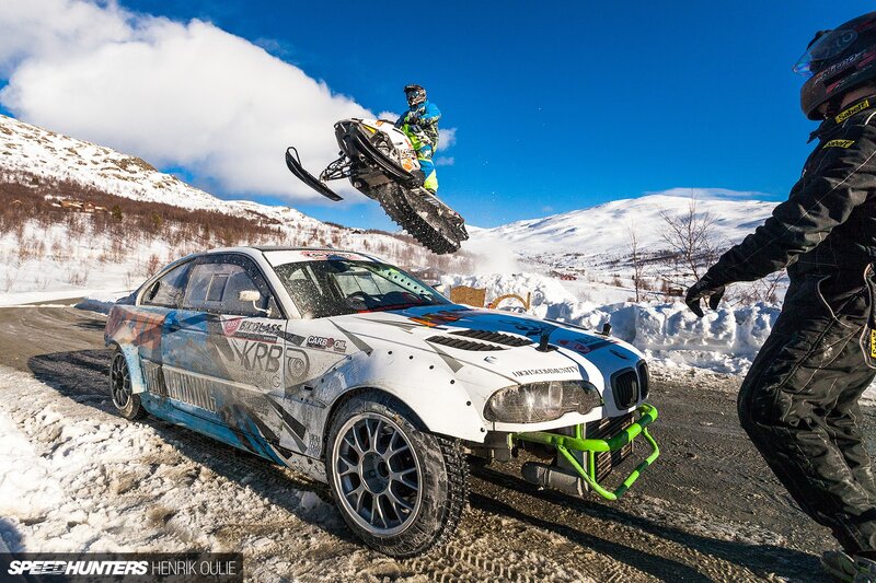 Snowmobile Jumping over Car