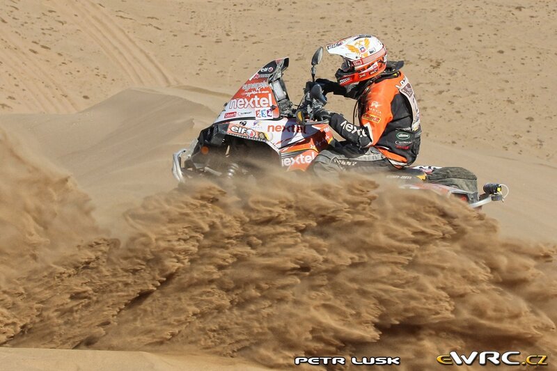 Snowmobiler on Sand Dune