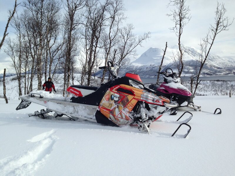 Snowmobiles in Snow