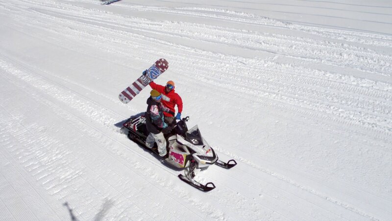 Snowmobiling with snowboard