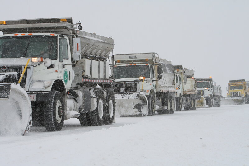 Snowplow convoy in snowstorm