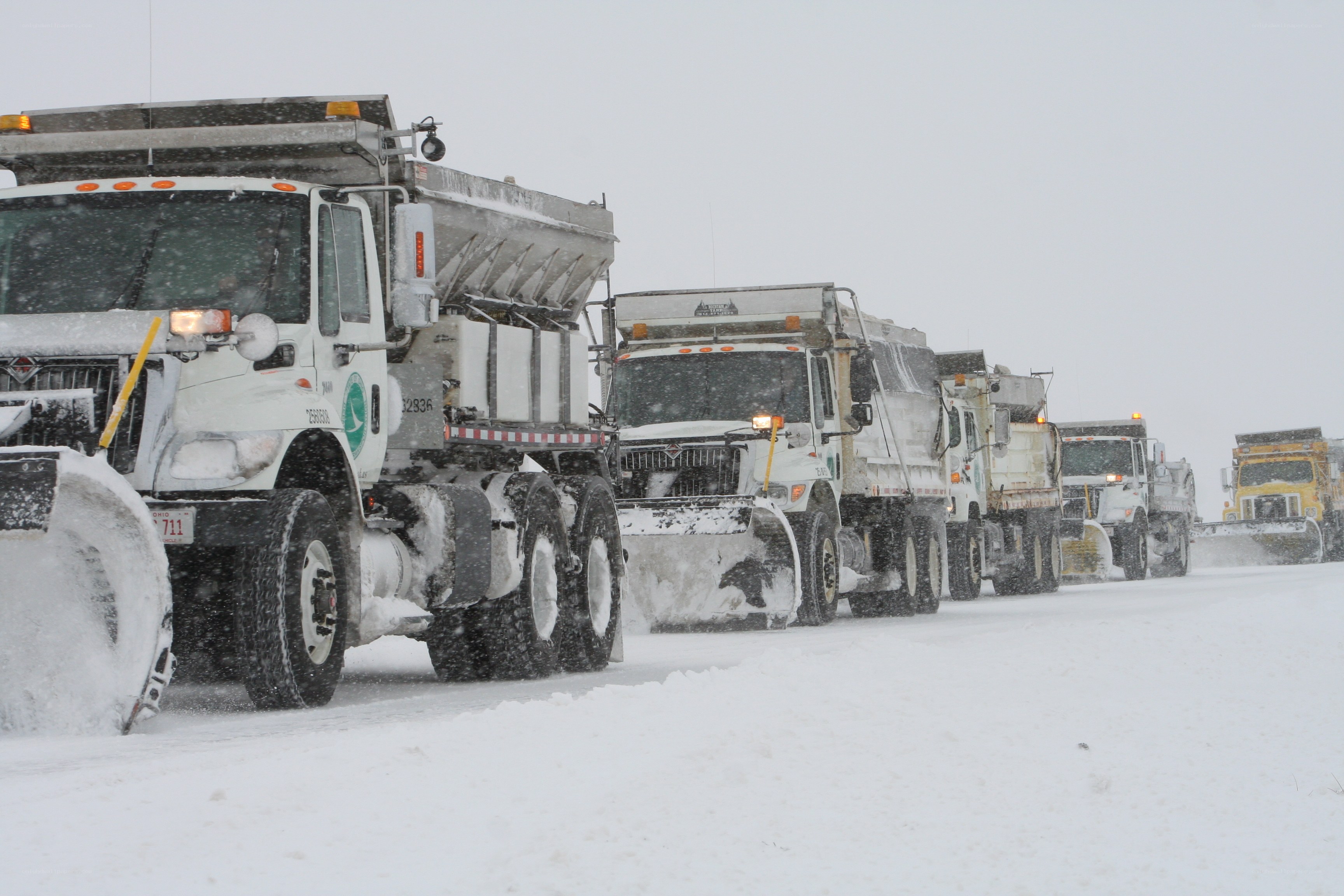 Snowplow convoy in snowstorm