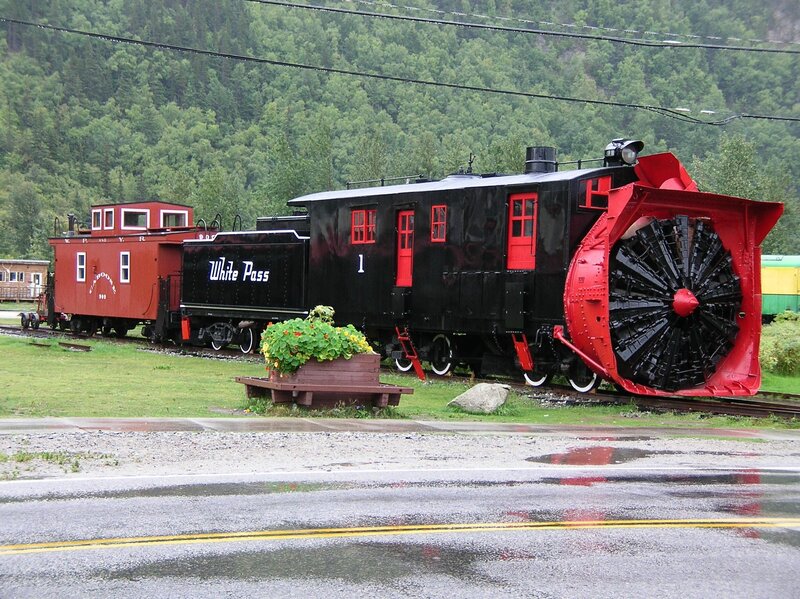 Snowplow train in a forest