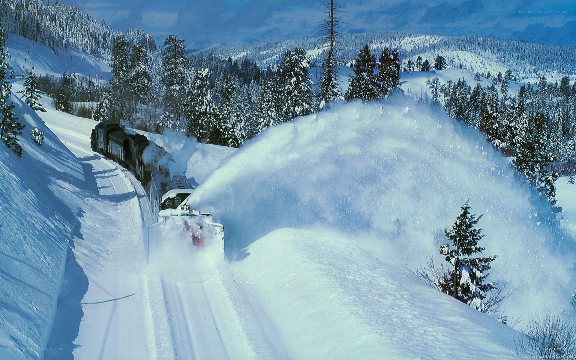 Snowplow train in winter landscape