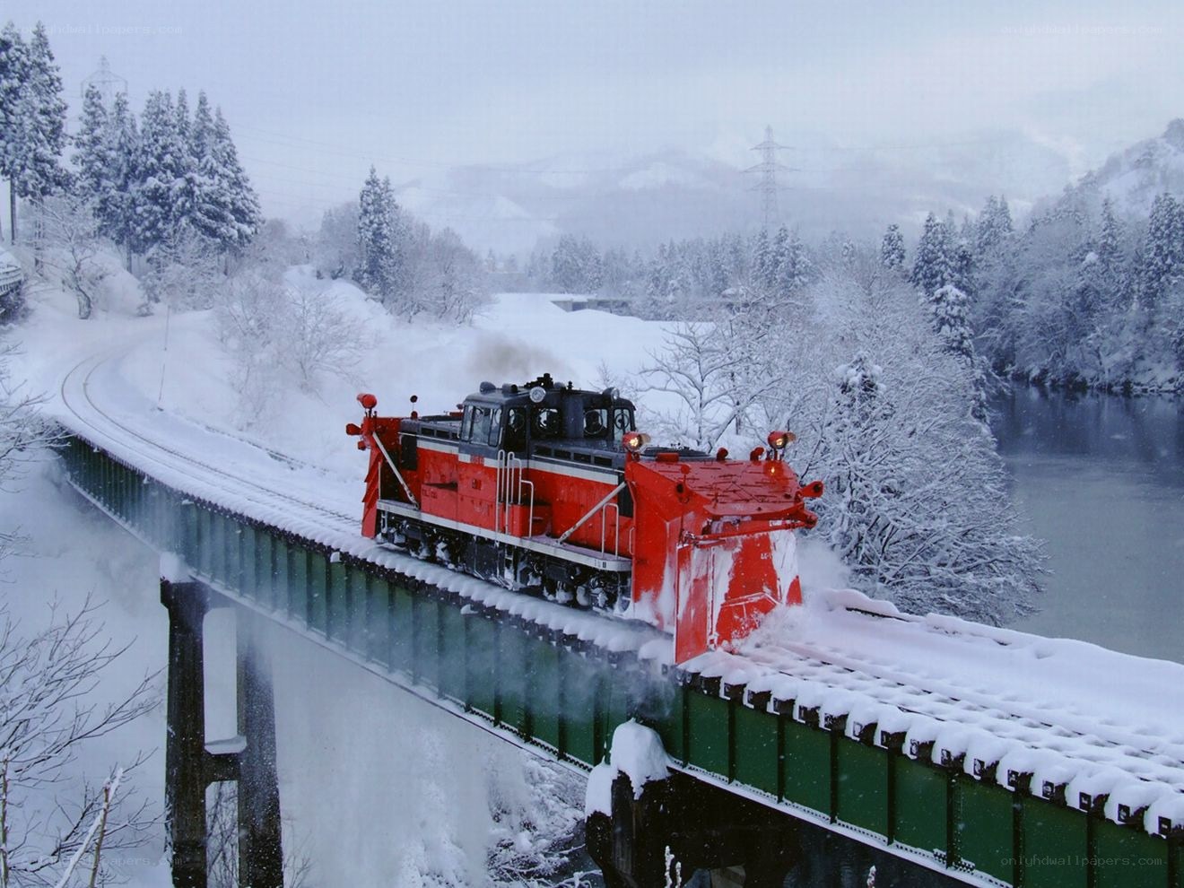 Snowplow train on a bridge