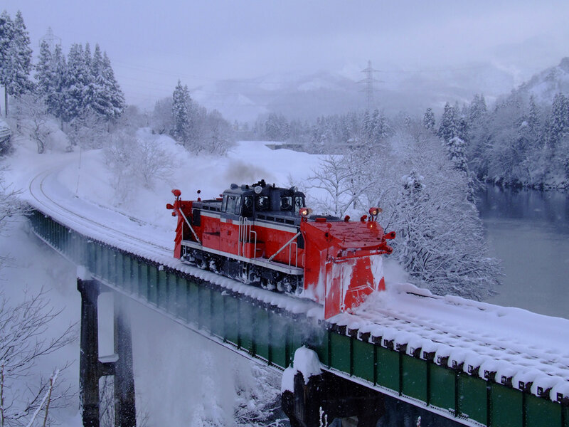 Snowplow train on a bridge