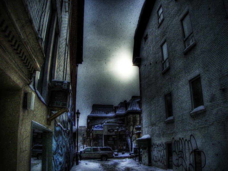 Snowy alley at night