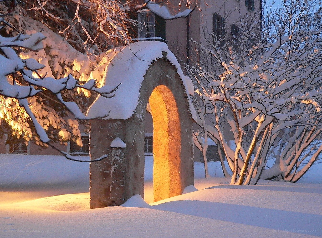 Snowy archway at sunset