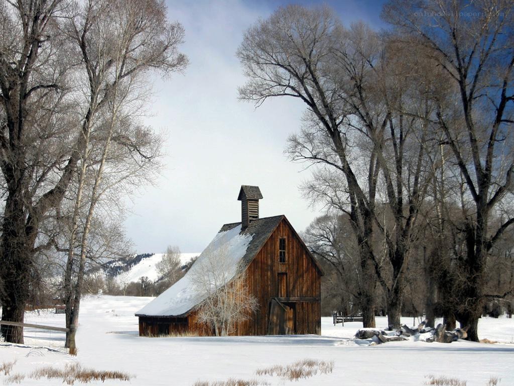 Snowy barn in winter landscape