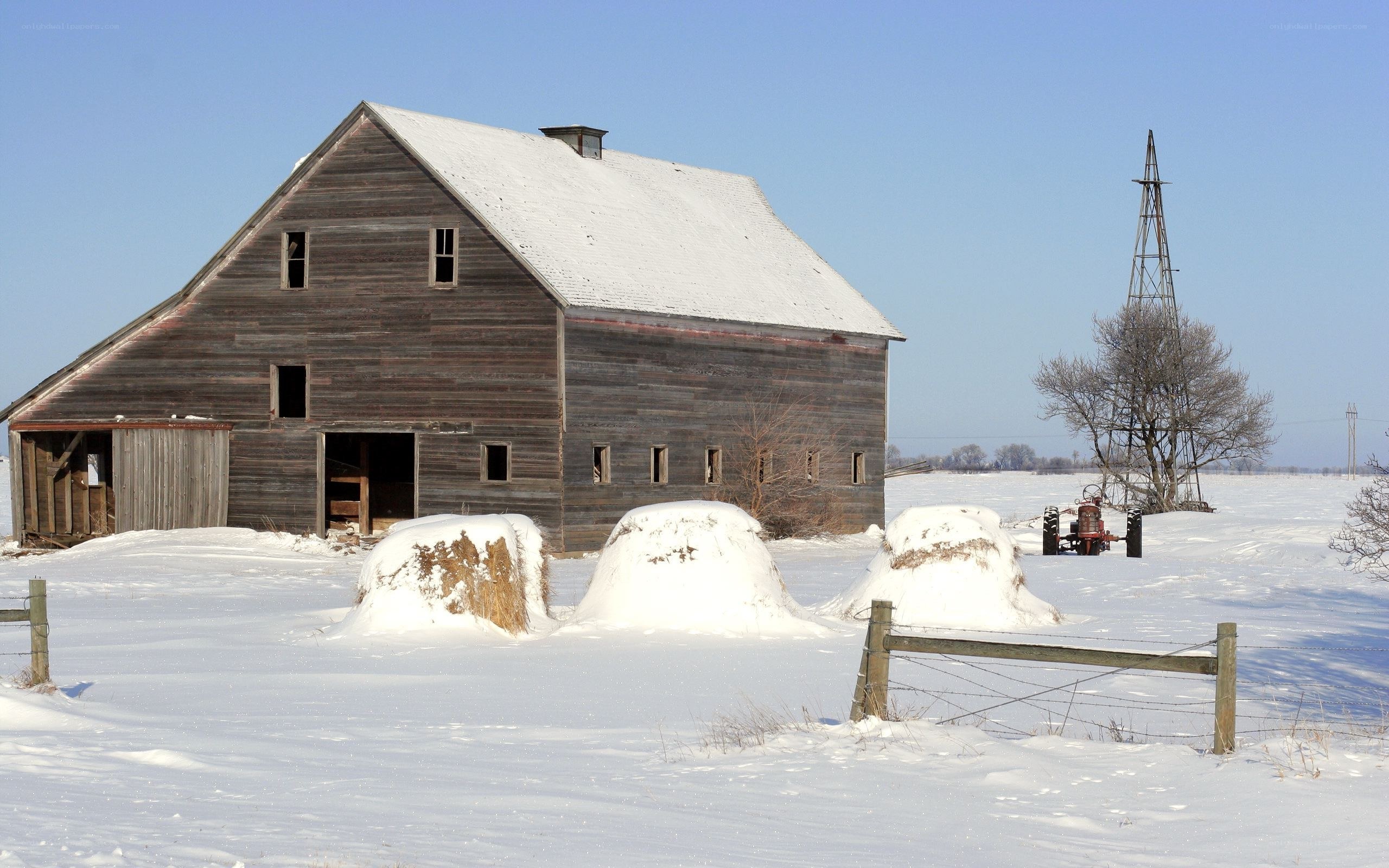 Snowy barn in winter landscape