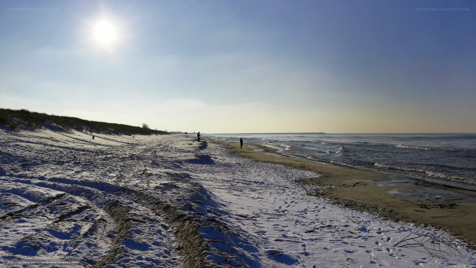 Snowy beach under bright sun