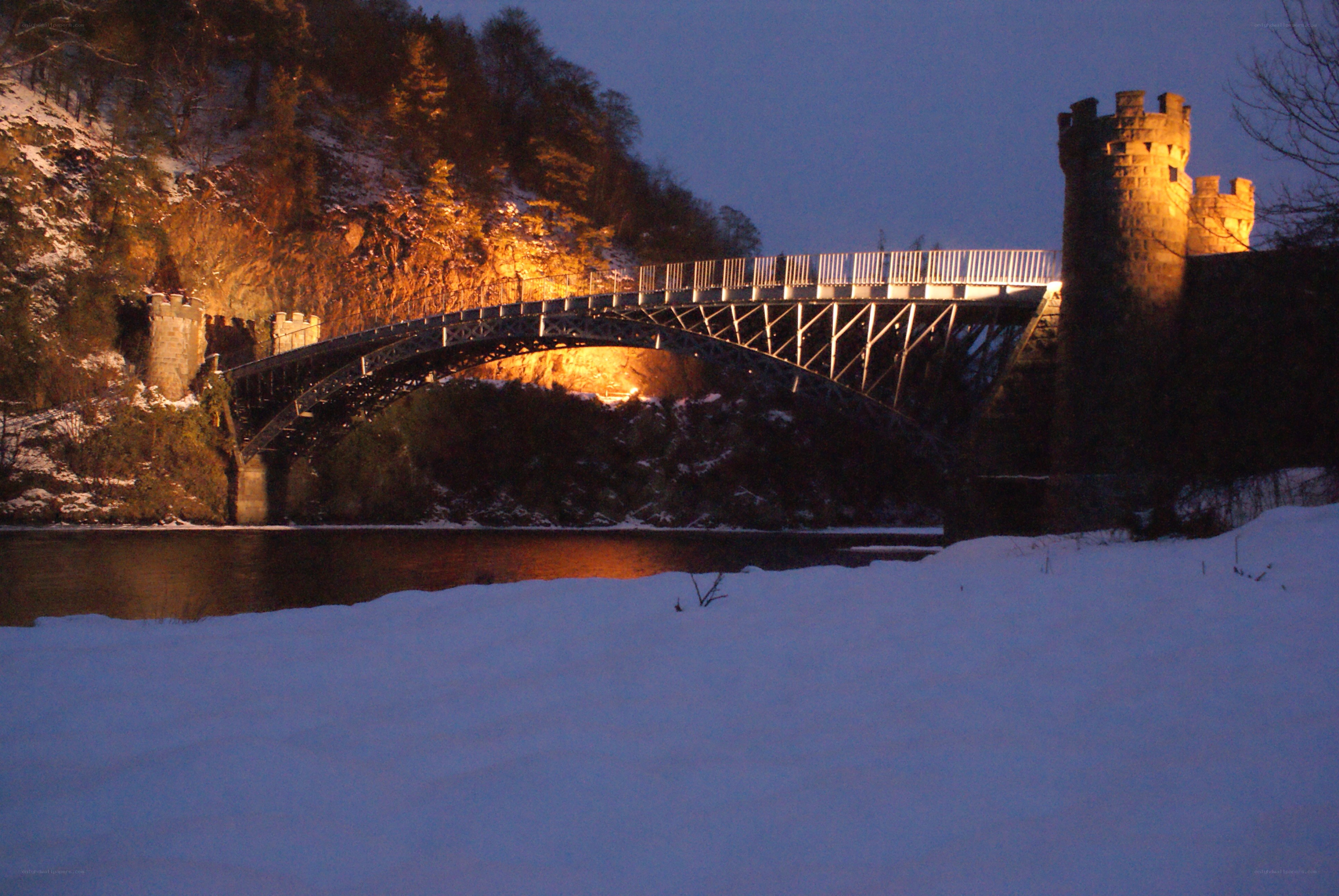 snowy bridge at dusk