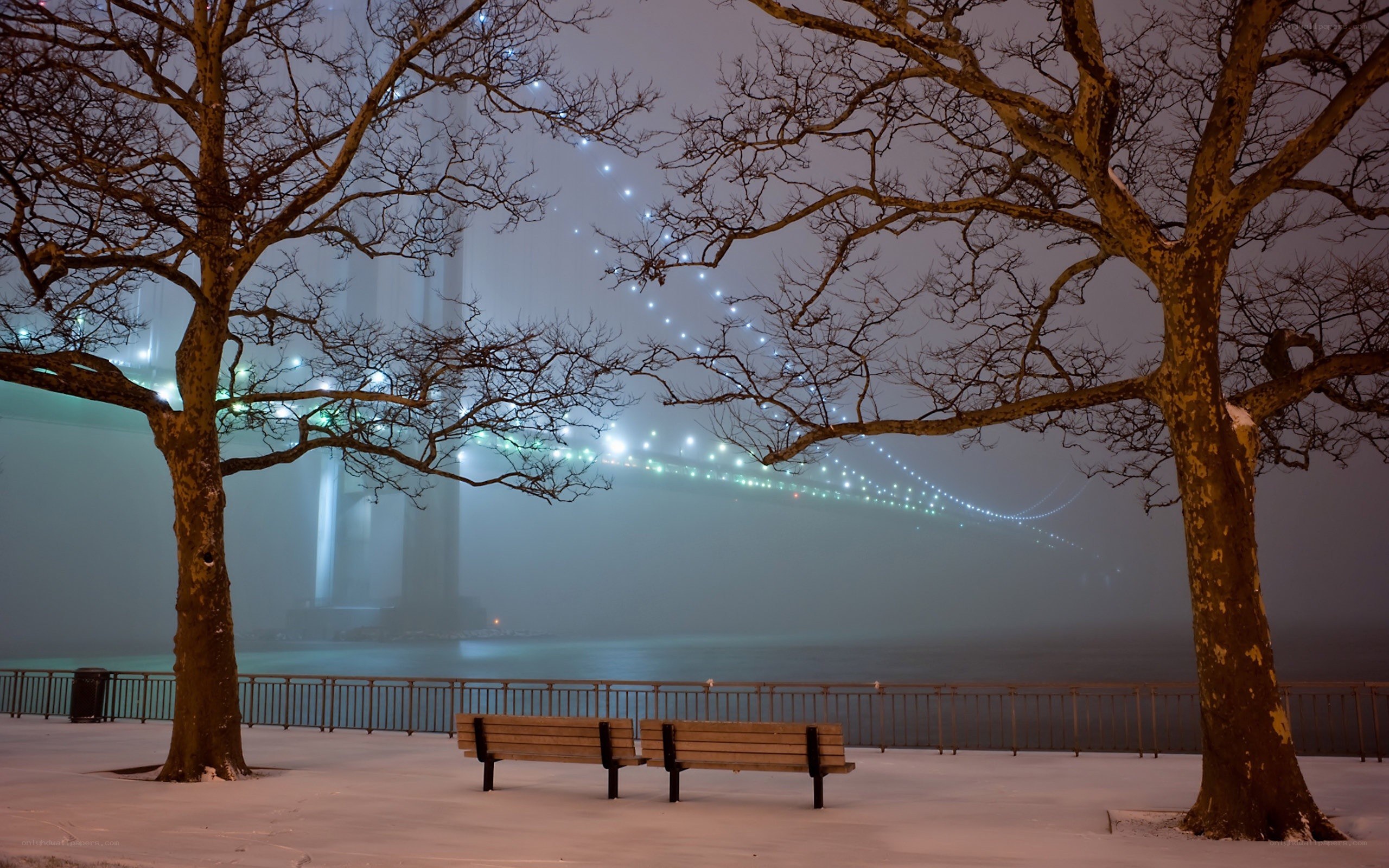 Snowy bridge at night
