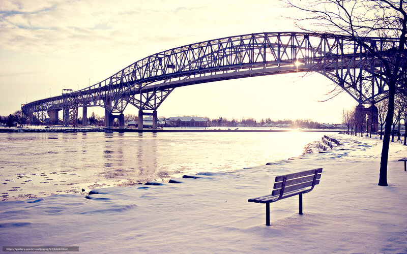 Snowy bridge at sunset