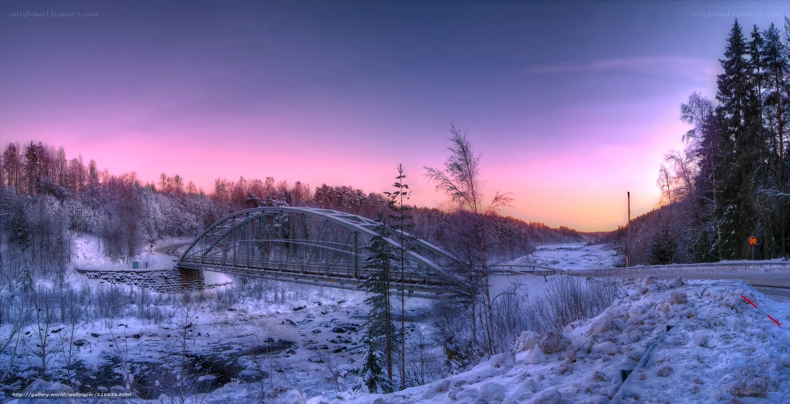 Snowy bridge at sunset