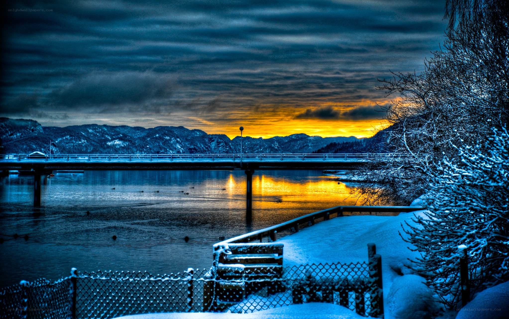 Snowy bridge at sunset