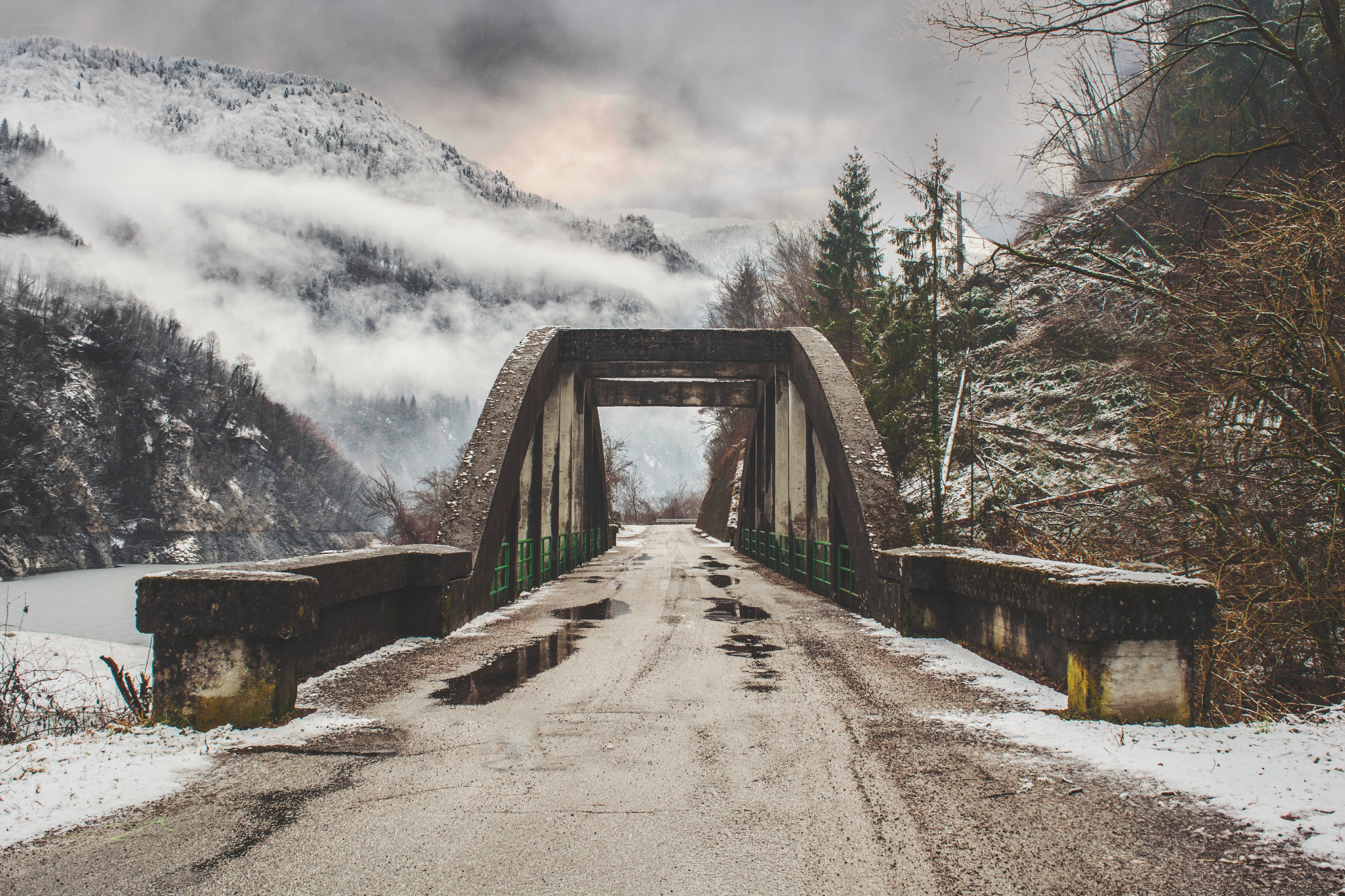 Snowy bridge in mountain valley