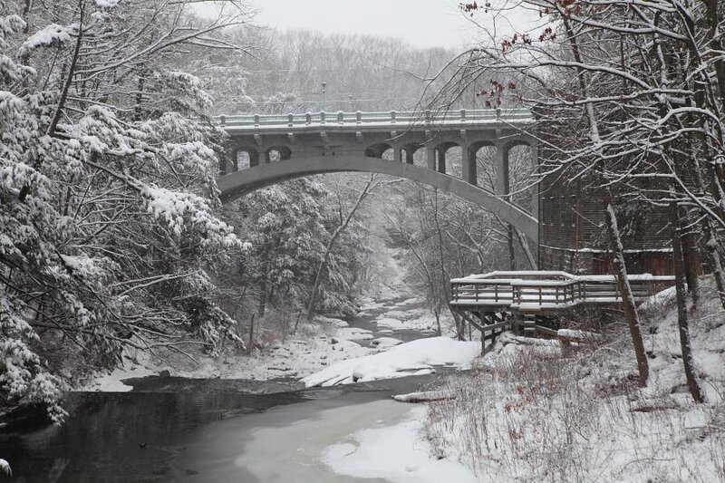 Snowy bridge over river