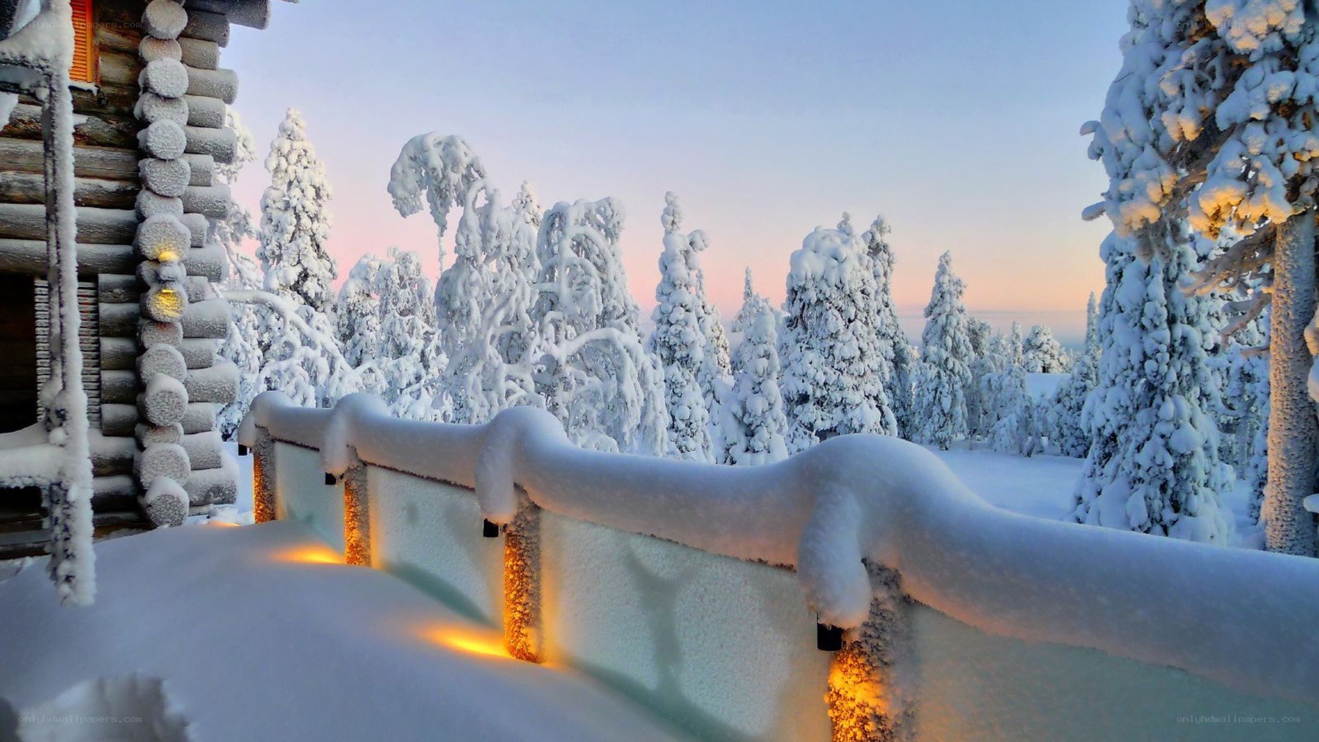 Snowy cabin at dawn