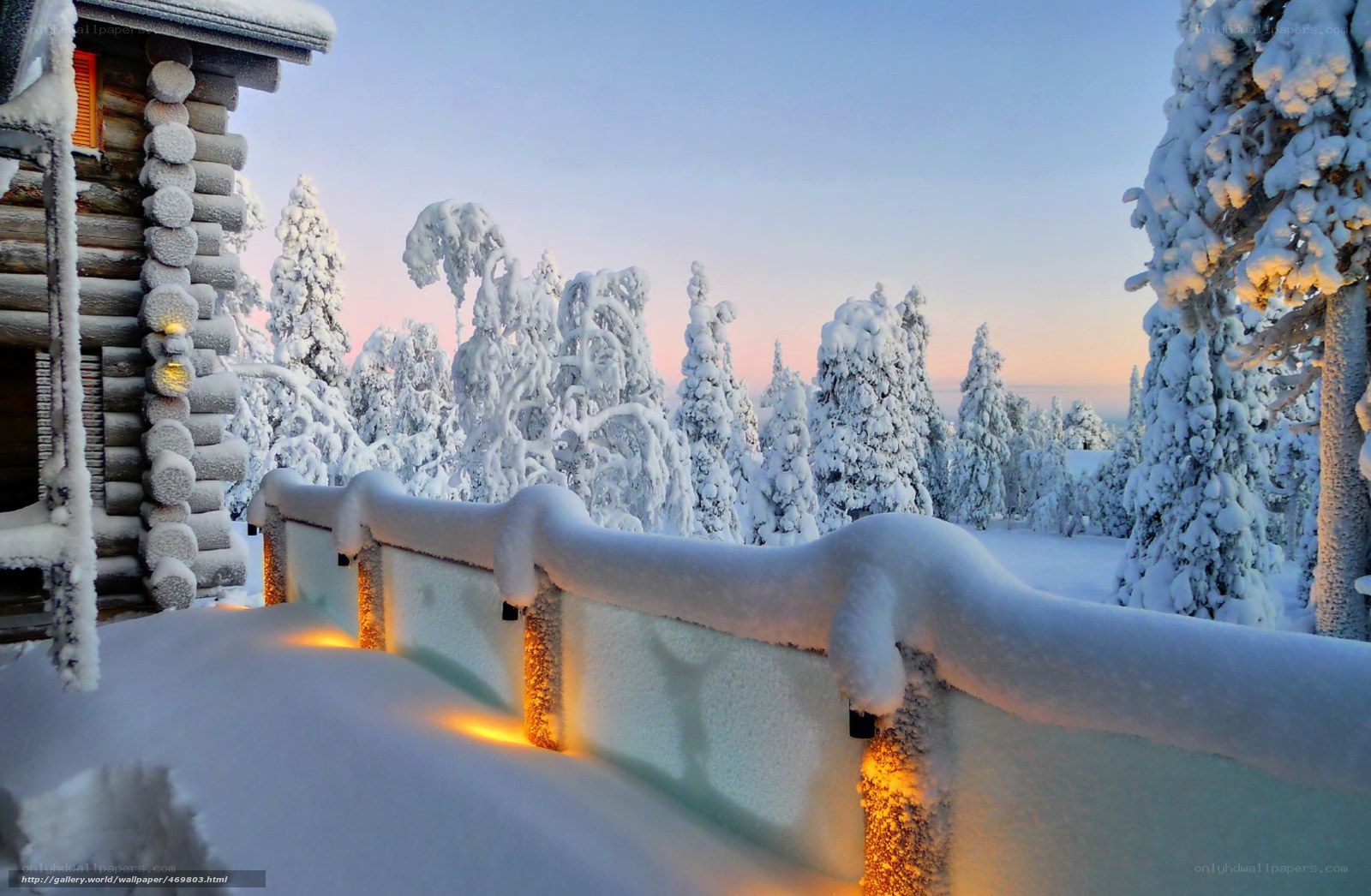 Snowy cabin at dawn