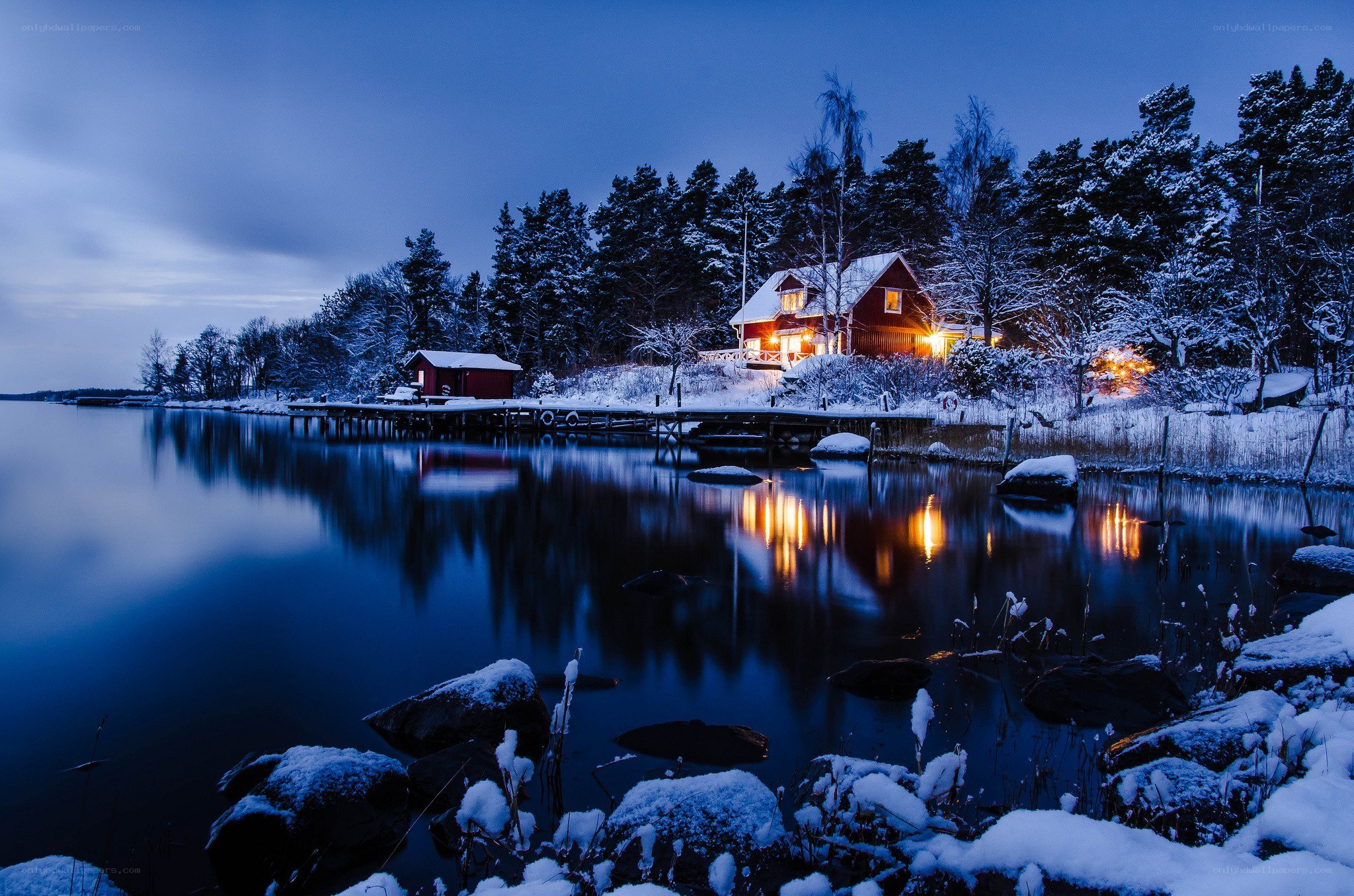 Snowy cabin at dusk