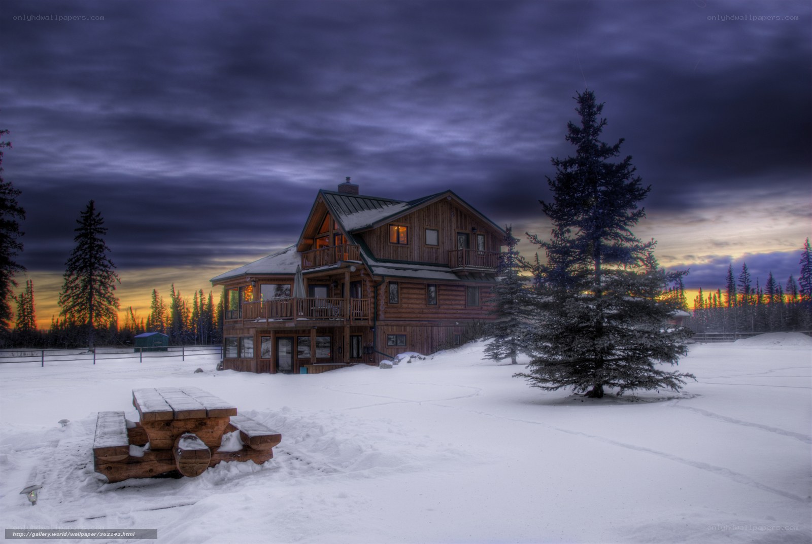 Snowy cabin at dusk