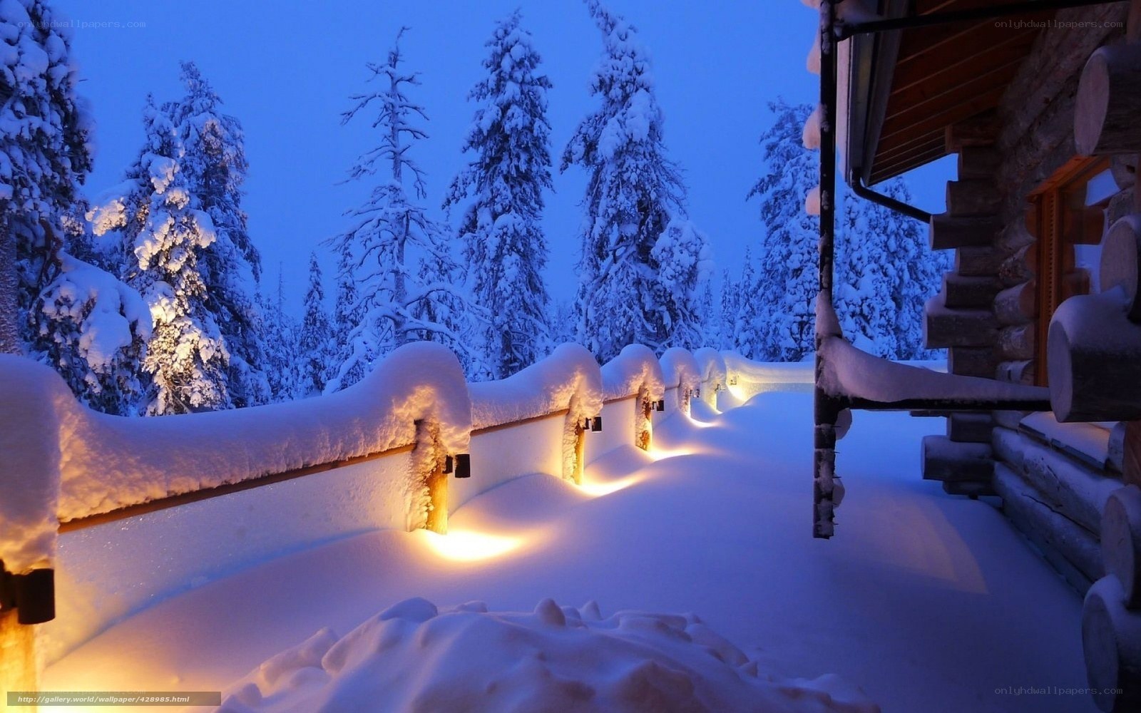 Snowy cabin at dusk