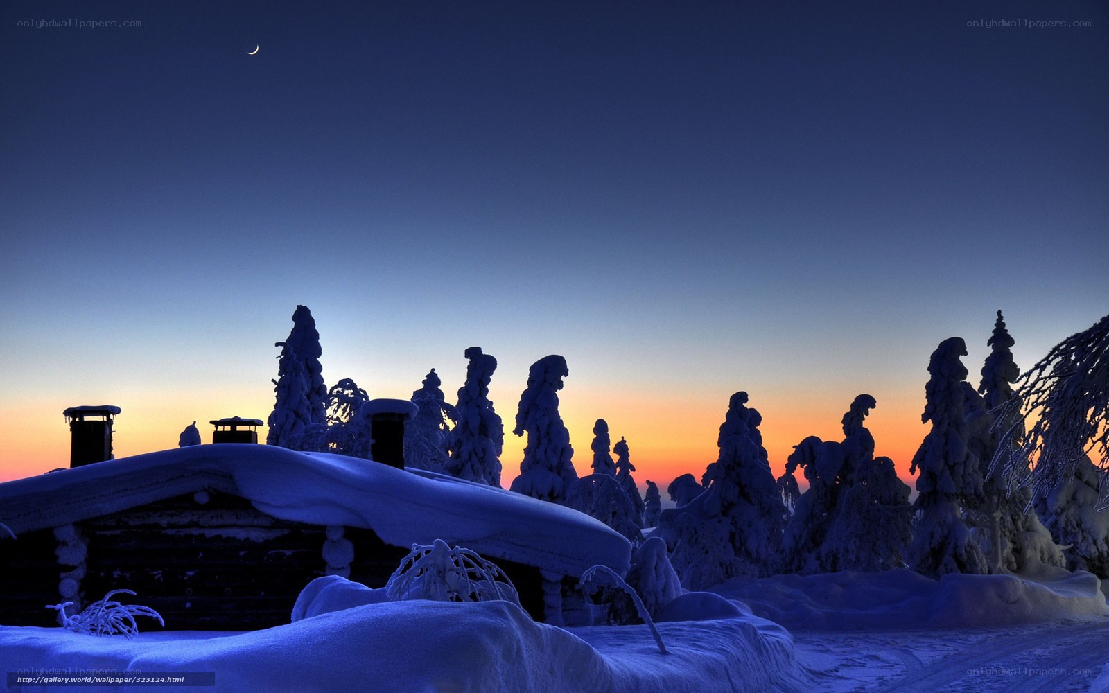 Snowy cabin at dusk