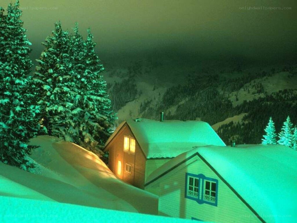 Snowy cabin at night